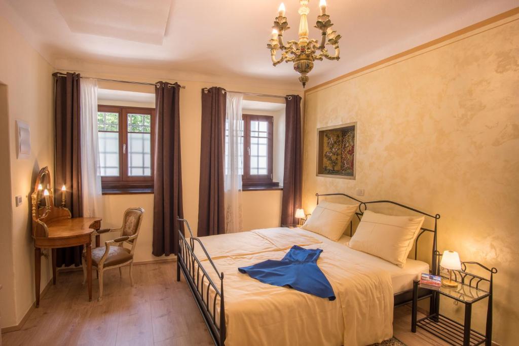 Postel nebo postele na pokoji v ubytování Vila Radolca apartments & rooms
