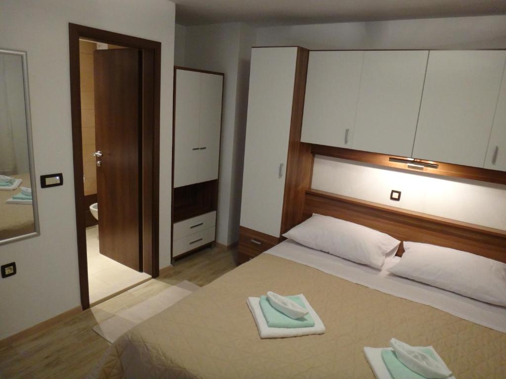 Posteľ alebo postele v izbe v ubytovaní Apartments Selina