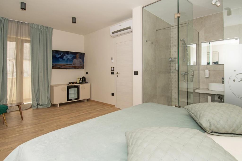 Postel nebo postele na pokoji v ubytování Fra&Kat Rooms