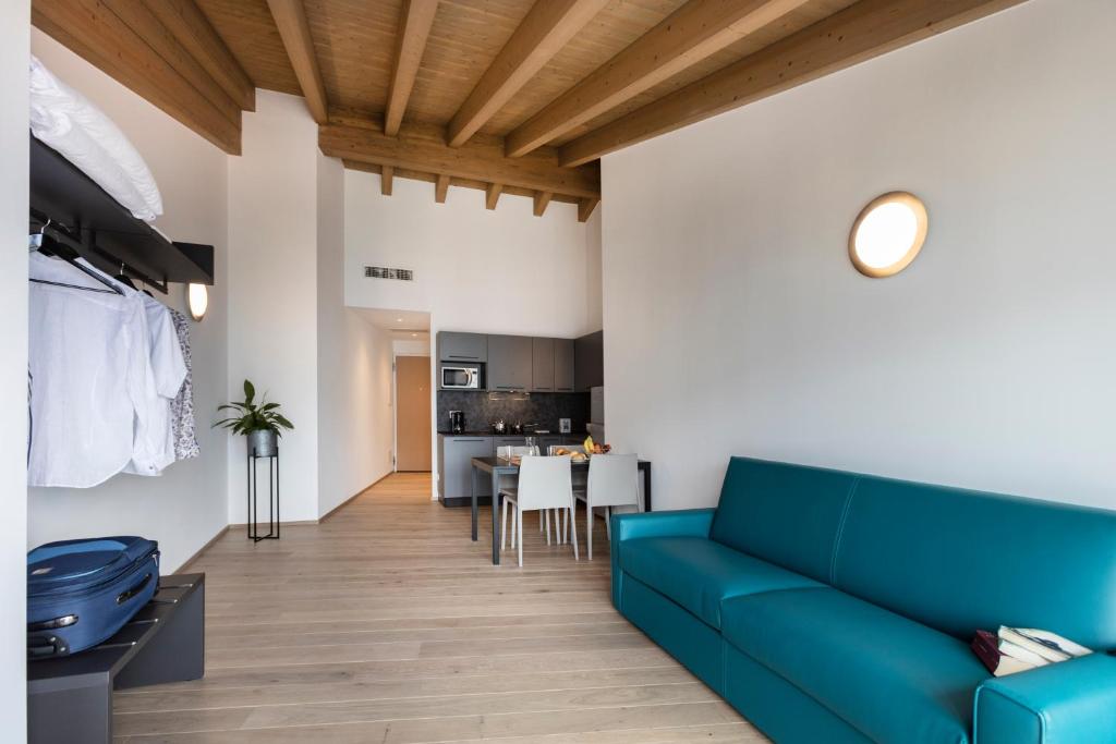 Televízia a/alebo spoločenská miestnosť v ubytovaní Residence Solei Classic & Plus