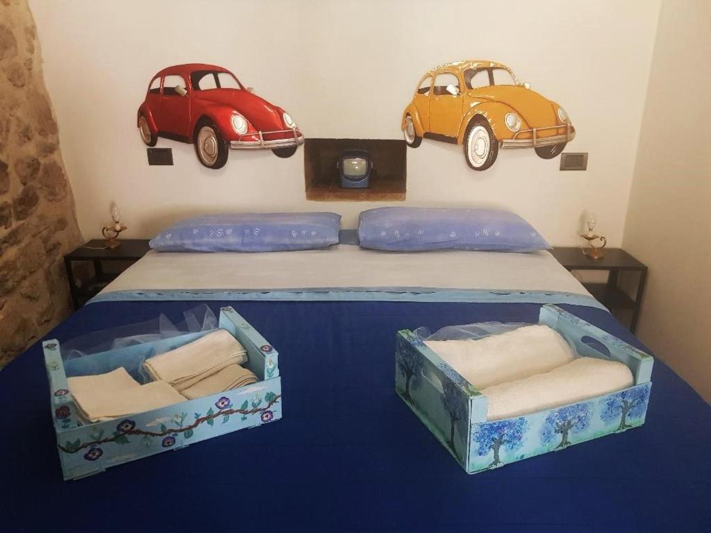 Posteľ alebo postele v izbe v ubytovaní Non ditelo al Duca - La Cappuccina
