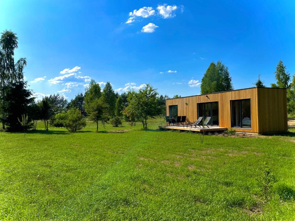 a house in a field with a large yard at Neverland in Zelwa