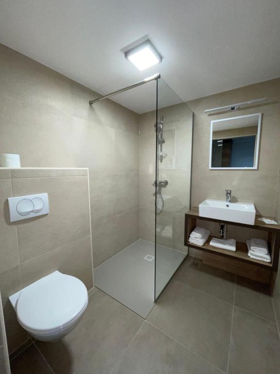 Koupelna v ubytování Hotel Roškar