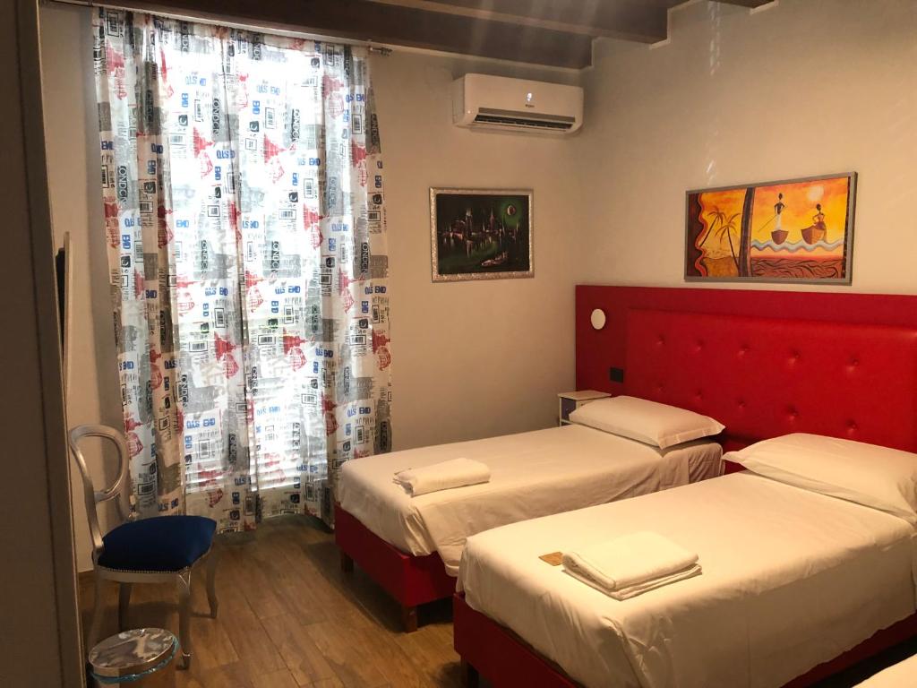 A bed or beds in a room at B&B Magada