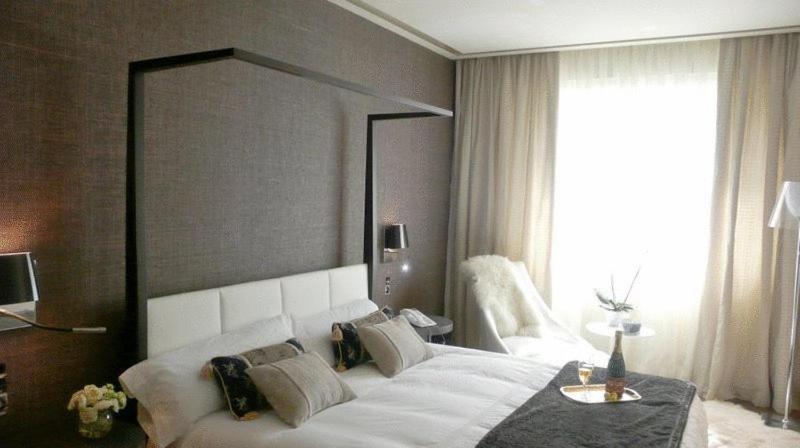 A bed or beds in a room at Gran Hotel Nagari Boutique & Spa