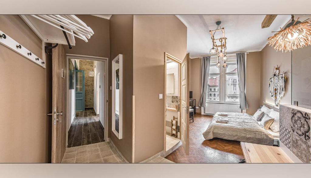 Postel nebo postele na pokoji v ubytování Boutique Suites Ráday
