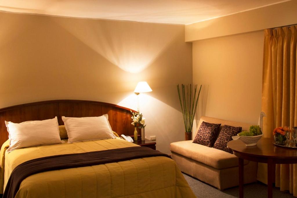 Postel nebo postele na pokoji v ubytování Hotel Park Suites