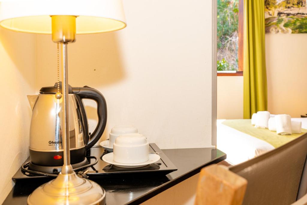 Příslušenství pro přípravu čaje a kávy v ubytování Tama Hotel