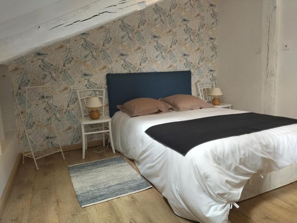Postel nebo postele na pokoji v ubytování Le Pressoir chambres d'hôtes