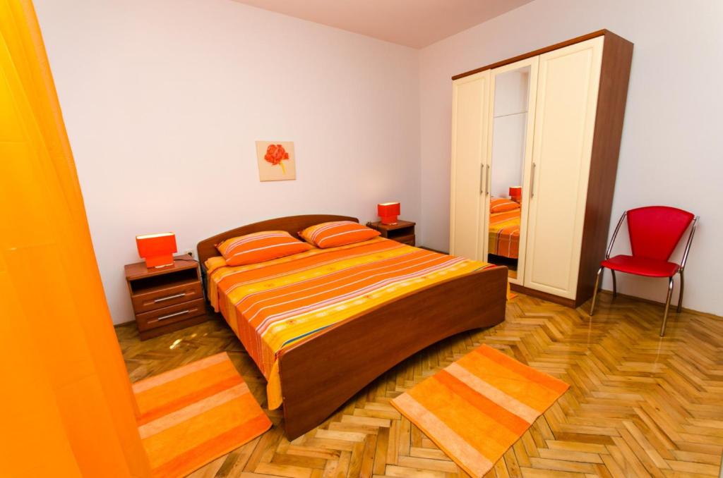 Postel nebo postele na pokoji v ubytování Apartments Ivana