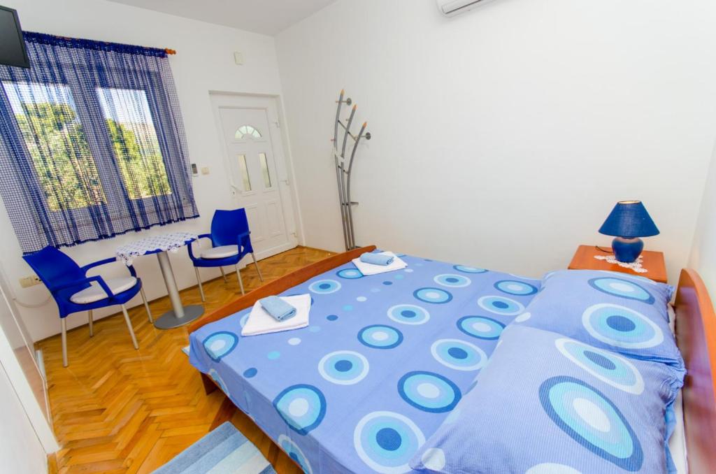 Postel nebo postele na pokoji v ubytování Apartments Ivana
