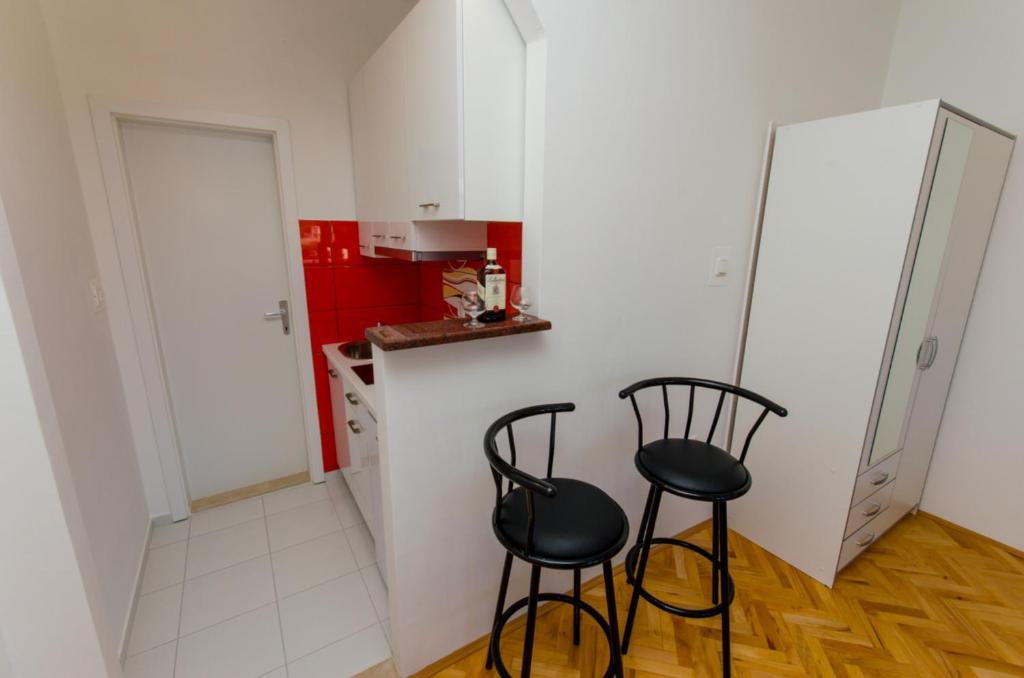 Kuchyň nebo kuchyňský kout v ubytování Apartments Ivana