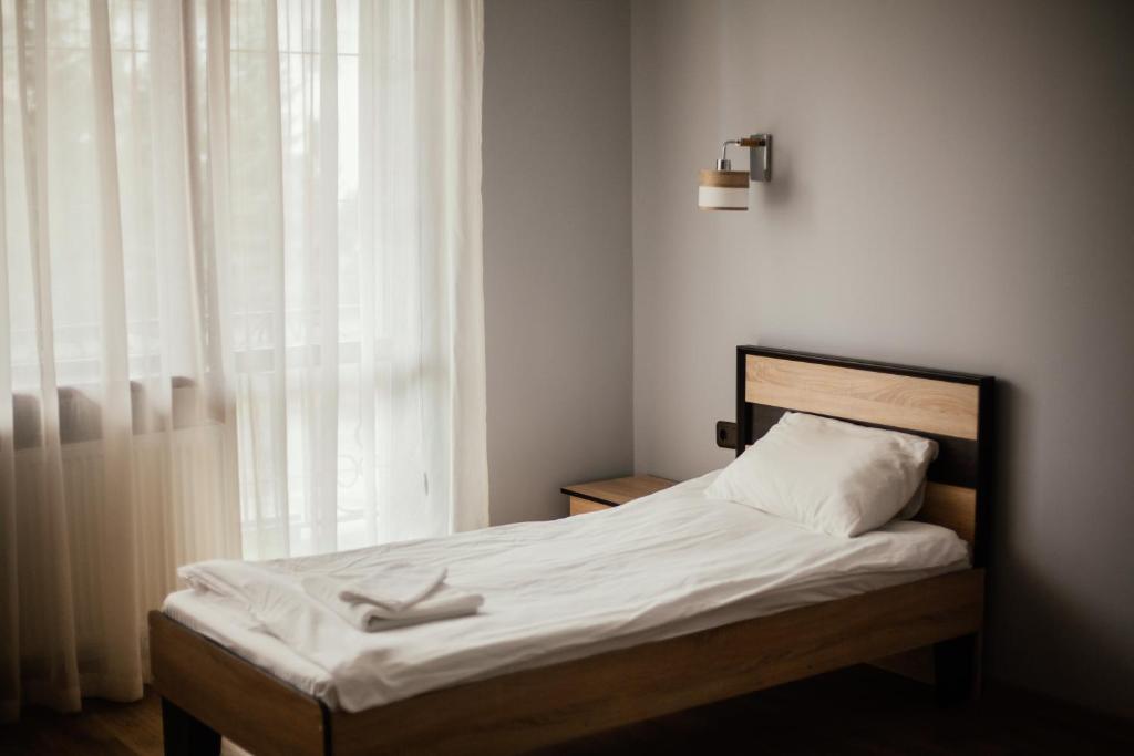 Postel nebo postele na pokoji v ubytování Forsage Hostel