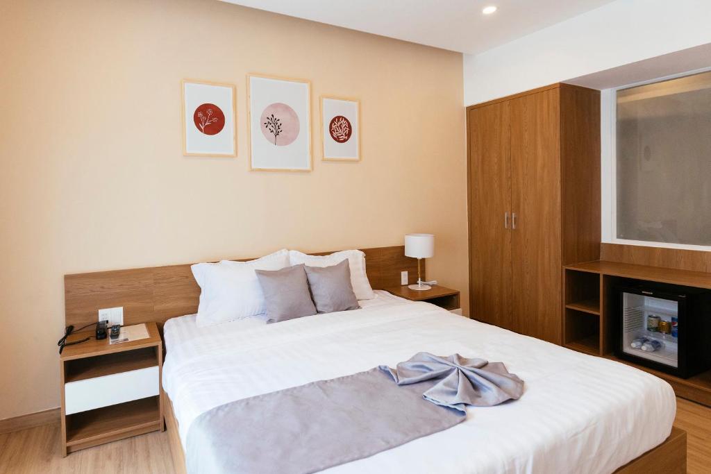 Postel nebo postele na pokoji v ubytování Minh Chi Hotel