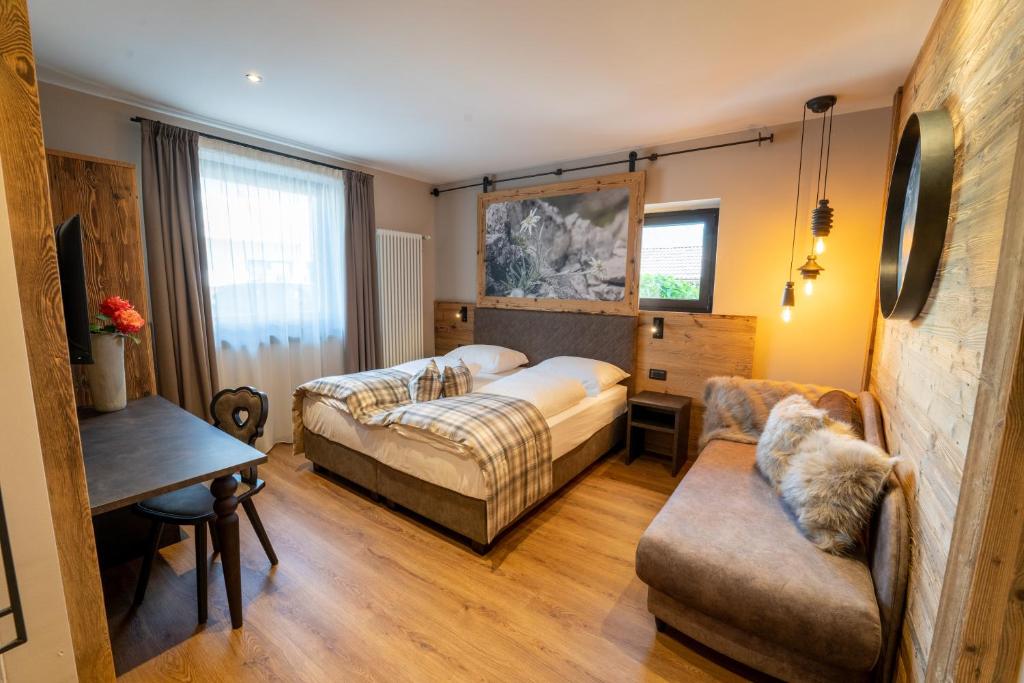 Postel nebo postele na pokoji v ubytování Hotel Alpenrose Wellness
