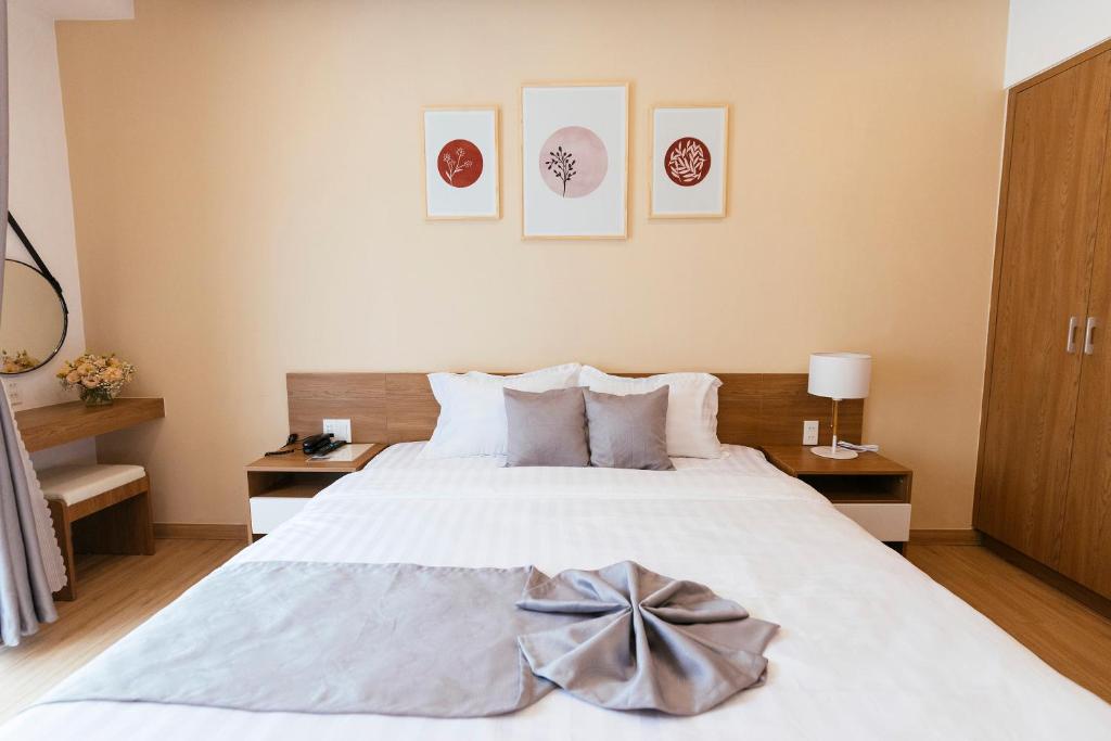 Postel nebo postele na pokoji v ubytování Minh Chi Hotel