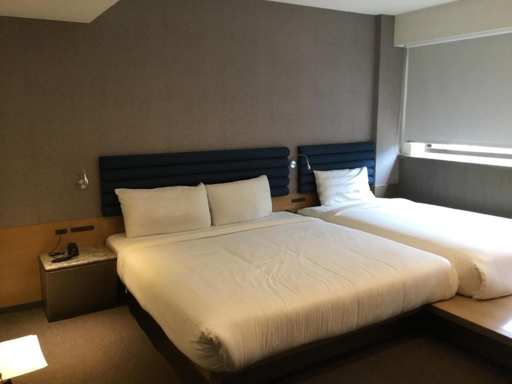 Letto o letti in una camera di Fu Kuang Hotel