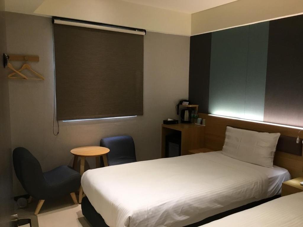 Letto o letti in una camera di Fu Kuang Hotel