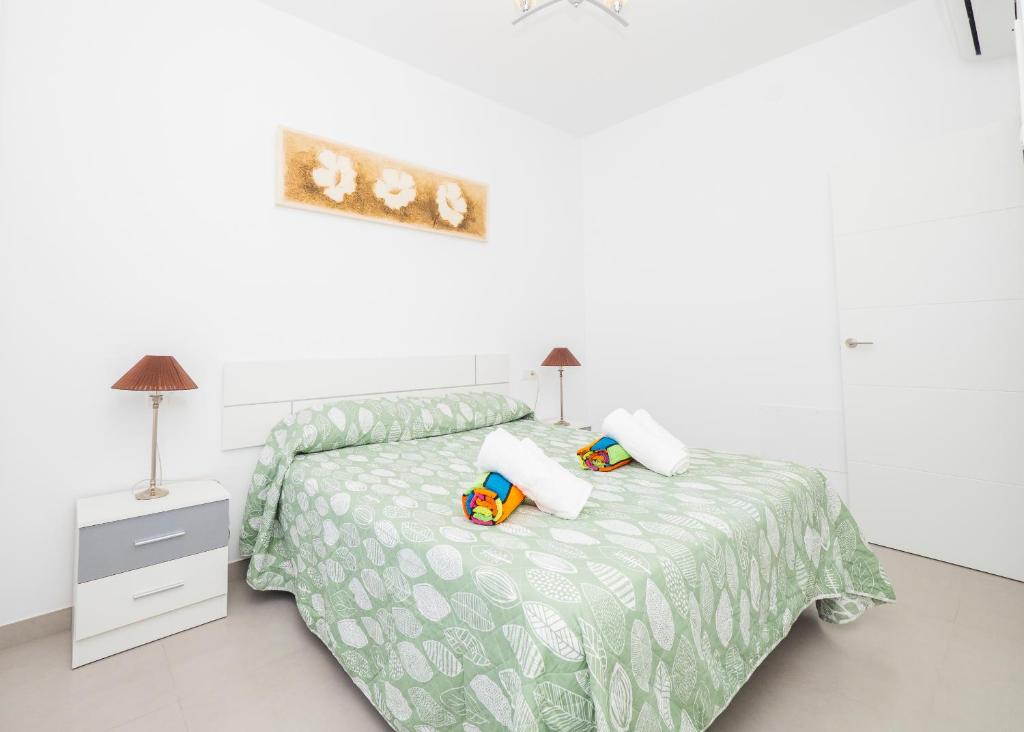 Posteľ alebo postele v izbe v ubytovaní Cubo's Villa Pilar