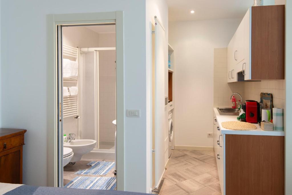 a kitchen with a sink and a toilet in a room at Casali appartamento in San Marino