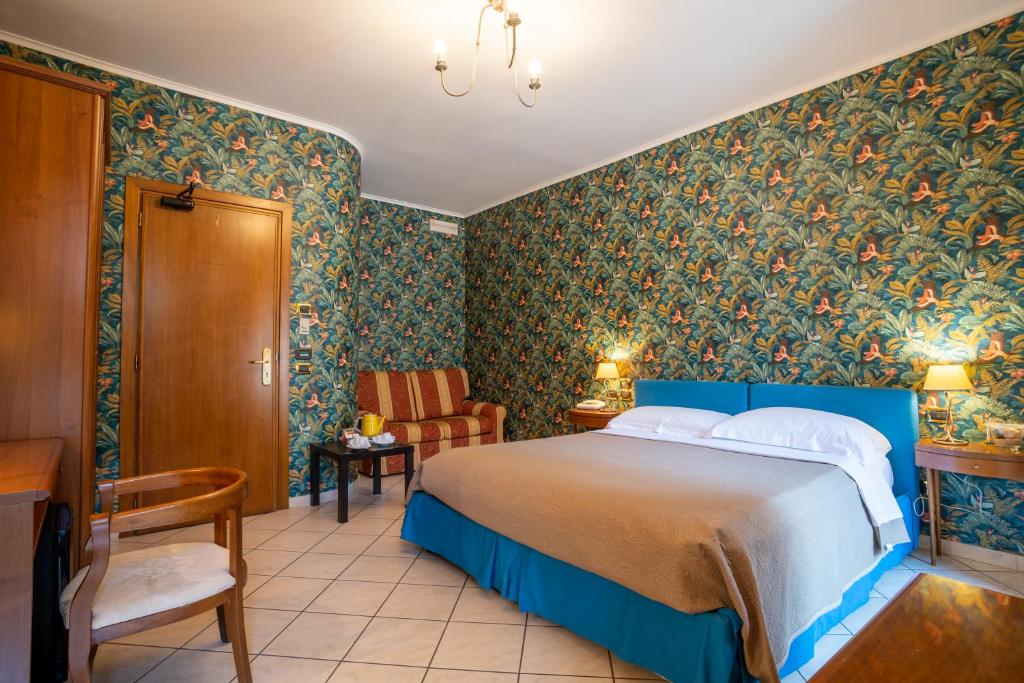 Postel nebo postele na pokoji v ubytování Locanda Da Otello
