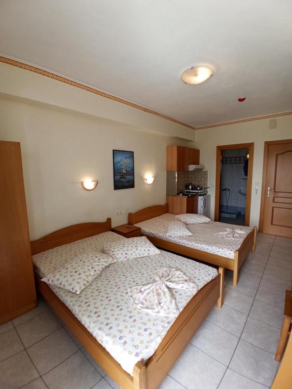 Postel nebo postele na pokoji v ubytování Villa Cosmos Inn