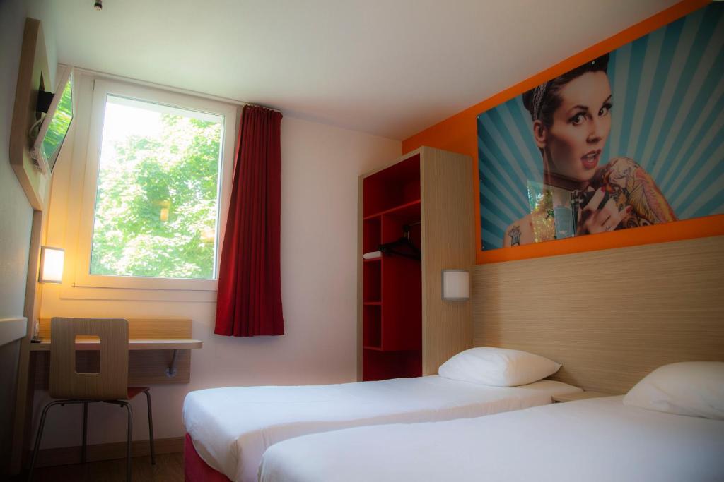Postel nebo postele na pokoji v ubytování Kyriad Direct Arras - Saint-Laurent-Blangy - Parc Expo