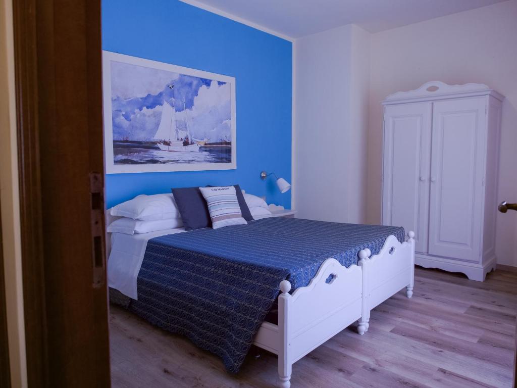 Postel nebo postele na pokoji v ubytování Hotel Corallo