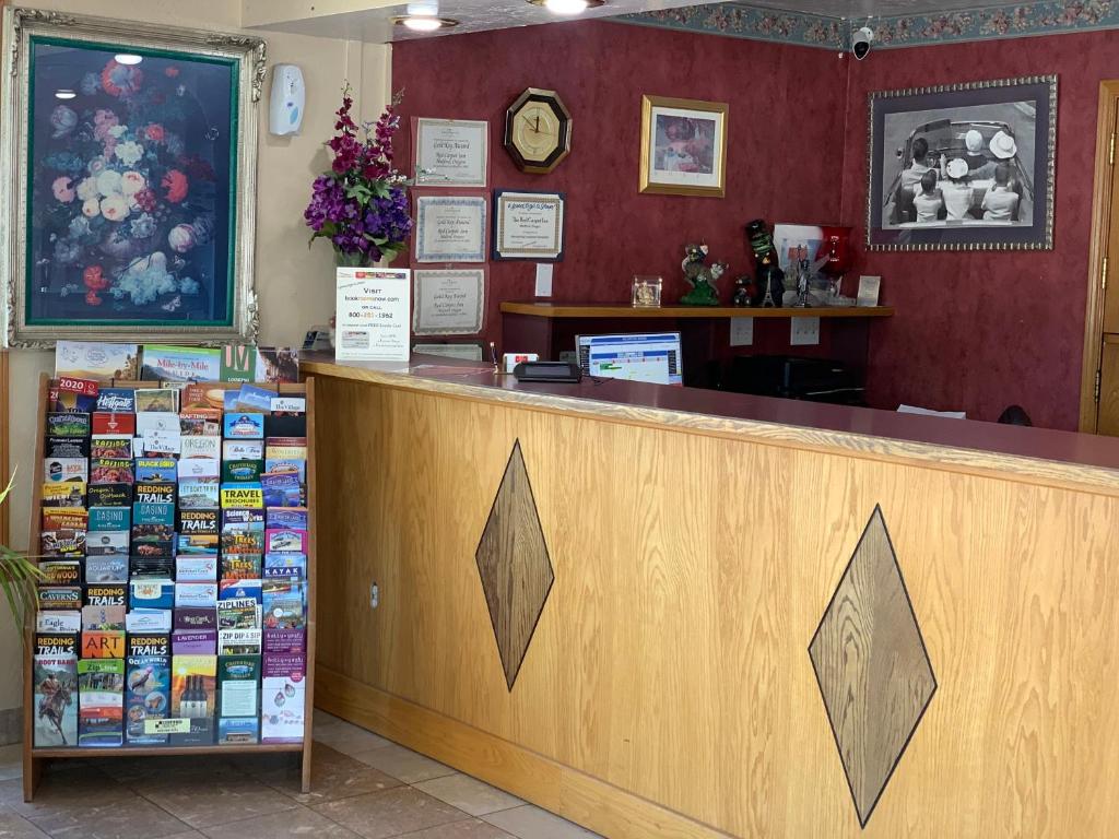 a counter in a restaurant with a counter top at Red Carpet Inn Medford in Medford