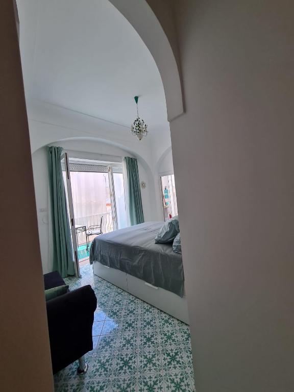 Łóżko lub łóżka w pokoju w obiekcie Casa Leucosia Suites