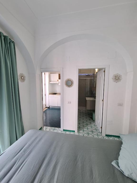 Łóżko lub łóżka w pokoju w obiekcie Casa Leucosia Suites
