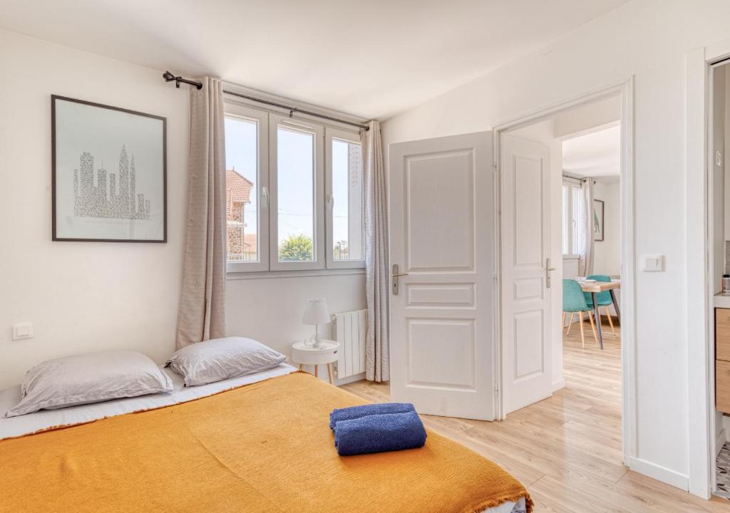 Кровать или кровати в номере COCON de DOUCEUR entre DISNEY et PARIS