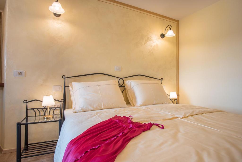 Säng eller sängar i ett rum på Vila Radolca apartments & rooms