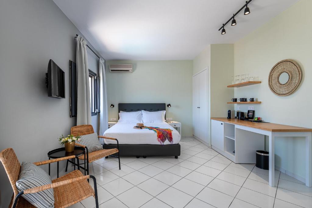 TV a/nebo společenská místnost v ubytování Minois Boutique Hotel
