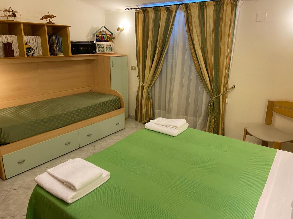 A bed or beds in a room at Residenza Antico Borgo del Pozzo
