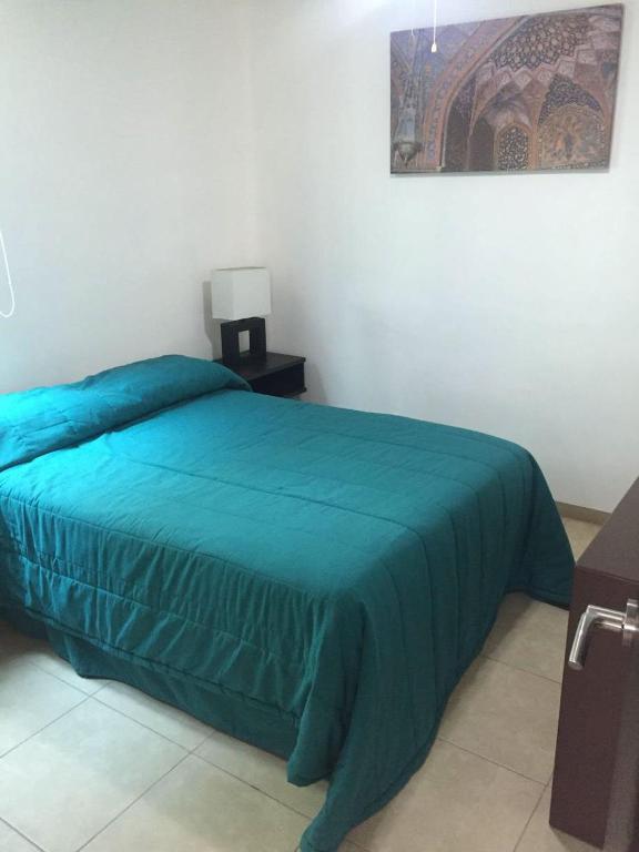 Postel nebo postele na pokoji v ubytování Zenharmony Suites