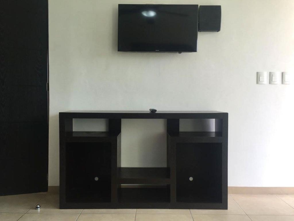 TV a/nebo společenská místnost v ubytování Zenharmony Suites
