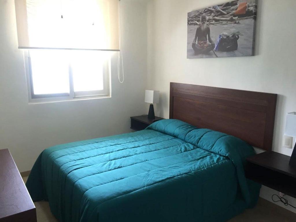 Postel nebo postele na pokoji v ubytování Zenharmony Suites