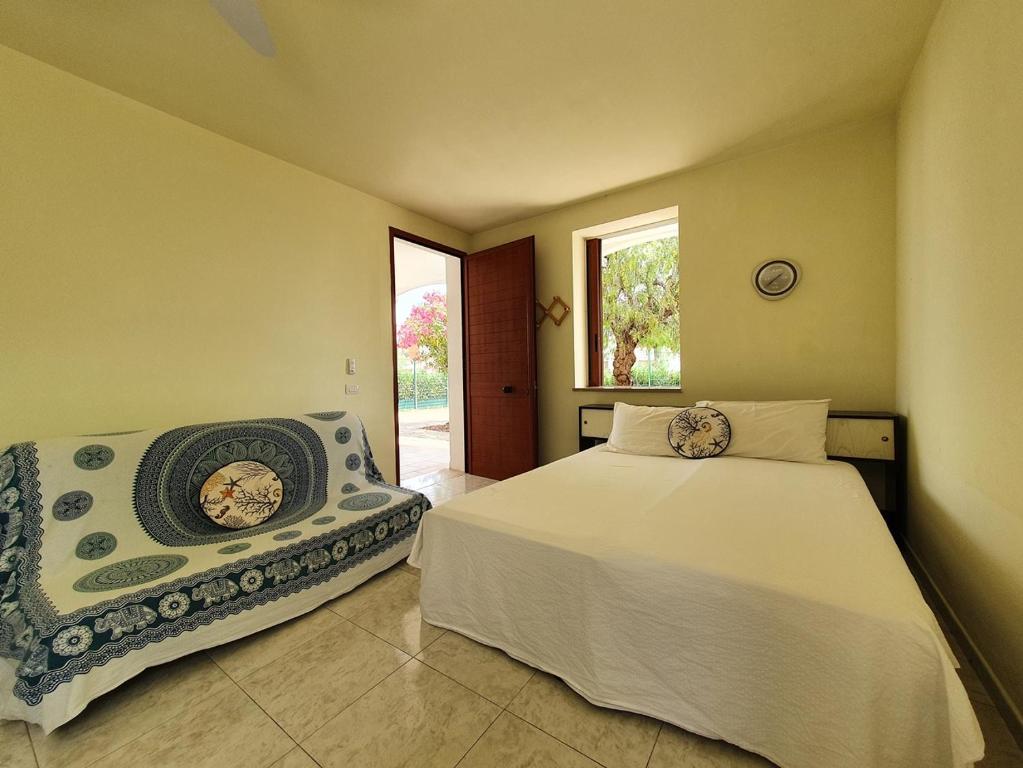 Postel nebo postele na pokoji v ubytování Via Ugento Apartments - a pochi passi dalle spiagge