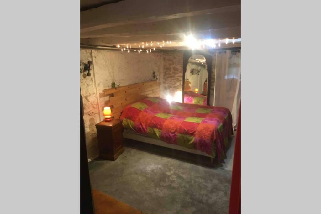 Кровать или кровати в номере maison Appart du mont july