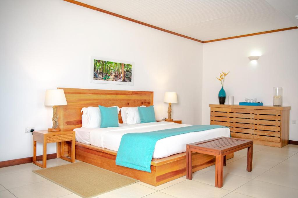Uma cama ou camas num quarto em Hotel L'Archipel