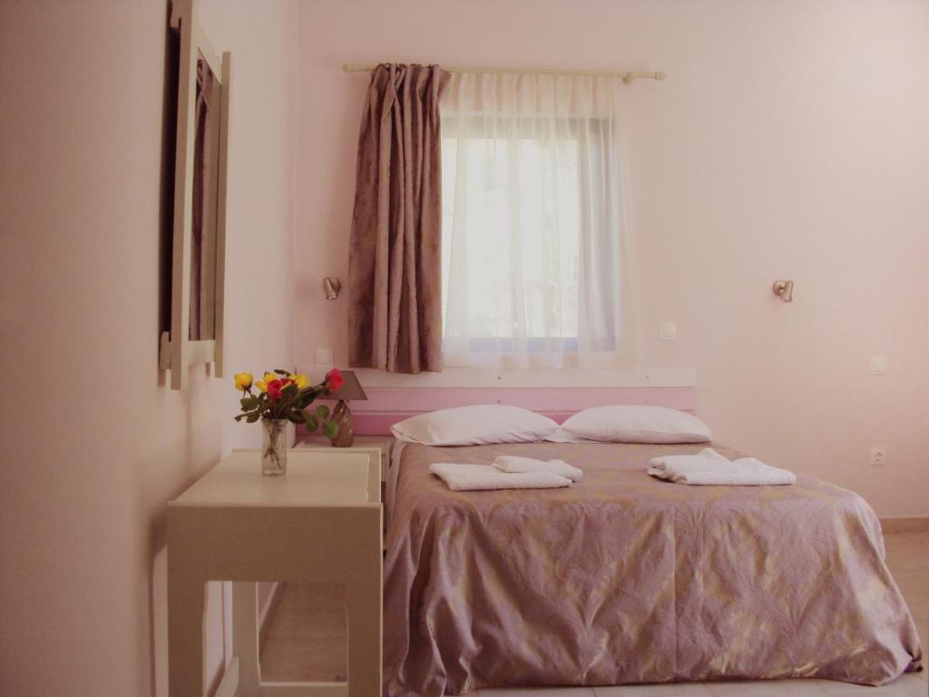 Postel nebo postele na pokoji v ubytování Yasemi Rooms