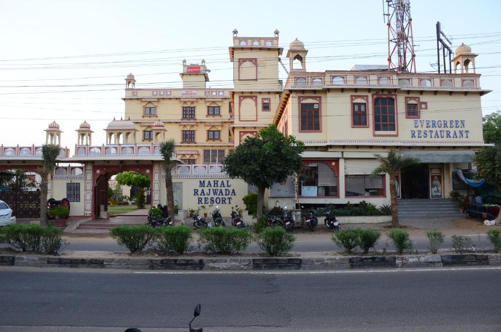 a large building on the side of a street at Mahal Rajwada-A Heritage Resort in Jaipur