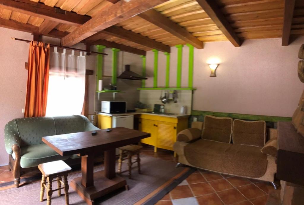 a living room with a couch and a table at Ребровач in Tatariv