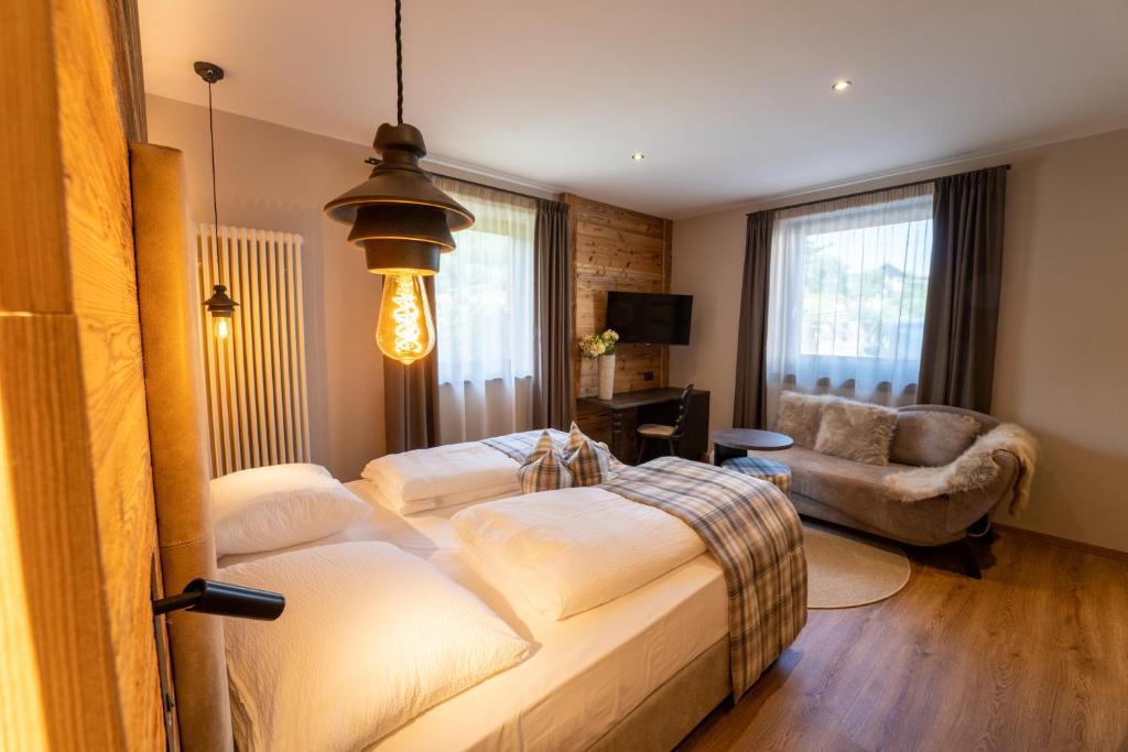 Postel nebo postele na pokoji v ubytování Hotel Alpenrose Wellness