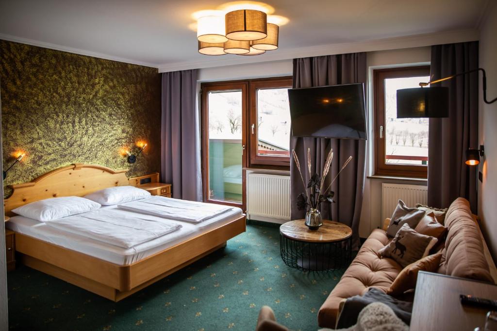 Postel nebo postele na pokoji v ubytování Hotel Restaurant tauernhex