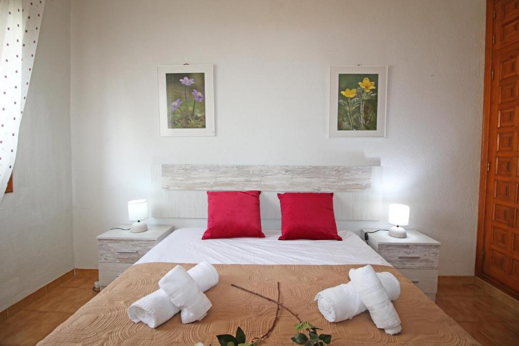 A bed or beds in a room at Residencial Tropicana