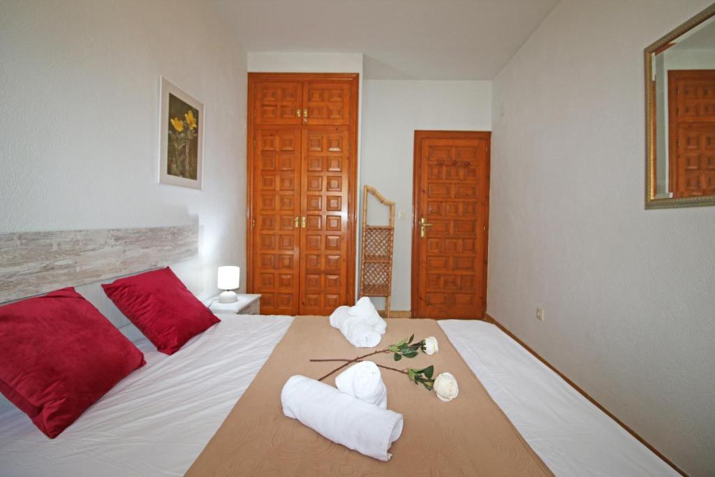 A bed or beds in a room at Residencial Tropicana