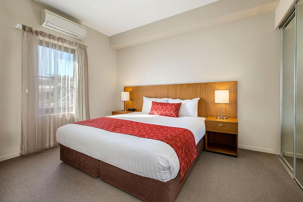 Postel nebo postele na pokoji v ubytování Gladstone Downtown Central Apartment Hotel Official