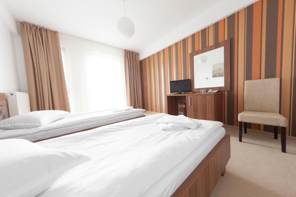 Postel nebo postele na pokoji v ubytování Hotel Mariss